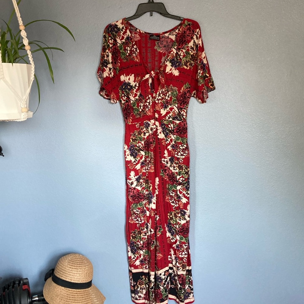 ANGIE Wide Leg bohemian floral jumpsuit with flirty peak a boo twist tie on top